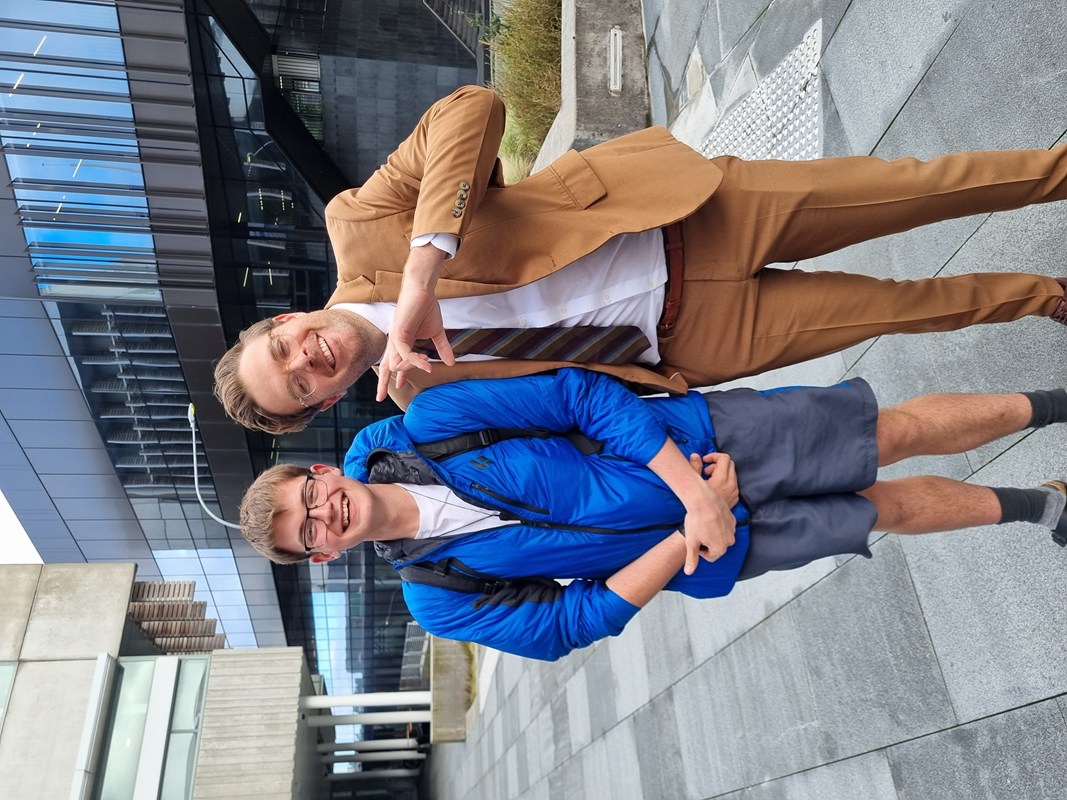 Jack Goodeve in a blue jacket looking small next to Guy Williams in his distinctive brown suit